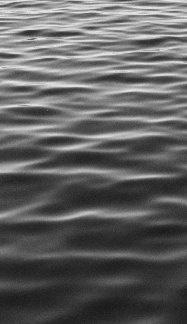 full-screen photo of rippling water surface